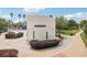 Close up of community gathering space with Park Square signage, well-maintained landscaping, and nearby shopfronts at 16113 Ternglade Dr, Lithia, FL 33547