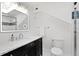 Bright bathroom with contemporary vanity, stylish mirror, and a glass-enclosed shower, perfect for a modern lifestyle at 1617 Oak Ne St, St Petersburg, FL 33704