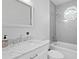 Updated bathroom with subway tile, octagonal window, marble countertop and updated vanity at 1617 Oak Ne St, St Petersburg, FL 33704