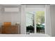 Bedroom featuring an air conditioner, dresser, and a view to the outdoors at 1617 Oak Ne St, St Petersburg, FL 33704