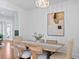 Bright dining room with wood table, stylish chairs, modern chandelier, and elegant decor at 1617 Oak Ne St, St Petersburg, FL 33704