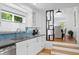 Updated kitchen with modern appliances and view of adjoining dining room at 1617 Oak Ne St, St Petersburg, FL 33704
