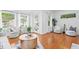 Spacious living room featuring hardwood floors, large windows, and comfortable seating at 1617 Oak Ne St, St Petersburg, FL 33704
