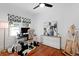Bright home office with hardwood floors, unique décor and a comfortable workspace at 1617 Oak Ne St, St Petersburg, FL 33704