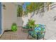 Cozy outdoor patio with lush plants, stylish rocking chairs, creating a serene and inviting seating area at 1617 Oak Ne St, St Petersburg, FL 33704