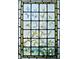 Intricate stained glass window panel featuring delicate floral and leaf designs at 1617 Oak Ne St, St Petersburg, FL 33704