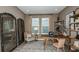 Comfortable home office with a wooden desk, lots of natural light, and ample storage at 1797 Trailhead Ln, Zephyrhills, FL 33541