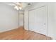 Bright bedroom features hardwood floors and a double door closet at 18502 Keystone Manor Rd, Odessa, FL 33556