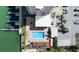 Stunning aerial view showcasing a community pool and hot tub, providing an oasis for relaxation and recreation at 223 Island Way # 2C, Clearwater Beach, FL 33767