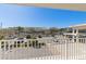 Scenic balcony view showcasing parking and trees, providing a relaxing outdoor space at 223 Island Way # 2C, Clearwater Beach, FL 33767