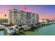 Multi-story waterfront condo with boat docks, parking, and balconies offering beautiful views at 223 Island Way # 2C, Clearwater Beach, FL 33767