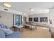 Comfortable condo lobby space with tiled floors, stylish seating, and decorative wall art and light fixtures at 223 Island Way # 2C, Clearwater Beach, FL 33767