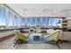 Bright lounge area with comfortable seating, large windows and plenty of natural light at 223 Island Way # 2C, Clearwater Beach, FL 33767