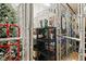 Secured storage area featuring metal fencing, black shelves, and various stored items for tenants' convenience at 223 Island Way # 2C, Clearwater Beach, FL 33767