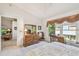 View of a bedroom with white walls, a window, and a glimpse into the adjacent living space at 2291 Americus W Blvd # 23, Clearwater, FL 33763