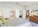 Bright bedroom with white walls, carpet floors, an ensuite bathroom and walk-in closet at 2291 Americus W Blvd # 23, Clearwater, FL 33763