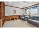 Spacious seating area with built-in bookcase and light-filled window at 2291 Americus W Blvd # 23, Clearwater, FL 33763