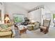 Inviting living room with lots of seating and natural light at 2291 Americus W Blvd # 23, Clearwater, FL 33763