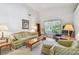 Comfortable living room with lots of seating and natural light at 2291 Americus W Blvd # 23, Clearwater, FL 33763