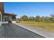 Expansive backyard with wood deck offering plenty of space for outdoor activities and relaxation at 3334 Pineview Dr, Holiday, FL 34691