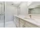 Bright bathroom showcases marble floors, glass shower, and double vanity sinks at 3334 Pineview Dr, Holiday, FL 34691