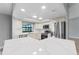 Updated kitchen with stainless steel appliances, quartz countertops, subway tile backsplash, and eat-in island at 3334 Pineview Dr, Holiday, FL 34691