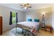 This bedroom features a ceiling fan, and a window letting in natural light at 3410 5Th W Dr, Palmetto, FL 34221
