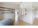 Casual bonus room with tile floors, wood shelving, and a pass-through window into the kitchen at 3410 5Th W Dr, Palmetto, FL 34221