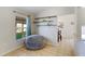 Casual bonus room with a beanbag chair, wood shelving, and natural light at 3410 5Th W Dr, Palmetto, FL 34221