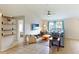 Spacious living room with neutral walls, tile flooring, and a ceiling fan, offering a versatile living space at 3410 5Th W Dr, Palmetto, FL 34221