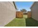 Side yard with a gate providing access to the backyard of the residence at 3410 5Th W Dr, Palmetto, FL 34221