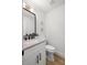 Contemporary powder room with white cabinetry, marble countertop, and modern fixtures at 4146 Brentwood Park Cir, Tampa, FL 33624