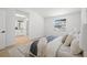 Bright bedroom with a large window and ensuite bathroom with a skylight and wood flooring at 4146 Brentwood Park Cir, Tampa, FL 33624
