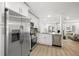Well-appointed kitchen flows into the living area, stainless steel appliances, and modern finishes at 4146 Brentwood Park Cir, Tampa, FL 33624