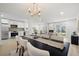 Open concept living space featuring a dining area, fireplace, and modern decor at 4146 Brentwood Park Cir, Tampa, FL 33624
