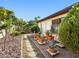 Lush garden with stone pathway features various cacti and tropical plants along the side of the house at 4532 W Idlewild Ave, Tampa, FL 33614