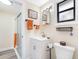 Well-lit bathroom with a glass-enclosed shower and a white vanity with a sink at 4532 W Idlewild Ave, Tampa, FL 33614