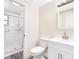 Modern bathroom with a glass-enclosed shower, white vanity, and neutral-colored walls at 4532 W Idlewild Ave, Tampa, FL 33614