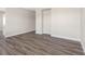 Well-lit bedroom showcasing modern flooring, a bright window, built in storage and ample space at 4532 W Idlewild Ave, Tampa, FL 33614
