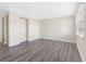 Well-lit bedroom showcasing modern flooring, a bright window, and ample space for comfort at 4532 W Idlewild Ave, Tampa, FL 33614