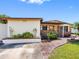 Inviting single-story home with brick accents, tidy landscaping, and well-maintained lawn at 4532 W Idlewild Ave, Tampa, FL 33614