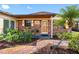 Inviting home featuring brick accents, with lush plants and well-kept yard at 4532 W Idlewild Ave, Tampa, FL 33614