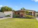 Charming single-story home with lush lawn, brick accents, and inviting front entry at 4532 W Idlewild Ave, Tampa, FL 33614