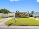 Inviting single-story home with green lawn, complemented by lovely landscaping and mailbox at 4532 W Idlewild Ave, Tampa, FL 33614