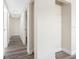 Bright hallway features neutral paint and trim with a built-in closet and light wood-look flooring at 4532 W Idlewild Ave, Tampa, FL 33614