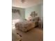 Comfortable bedroom with floral bedding, window with curtains, and matching accents at 4558 Blossom Blvd # D, Zephyrhills, FL 33542