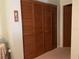 Spacious closet with louvered doors, offering ample storage space in a well-lit room at 4558 Blossom Blvd # D, Zephyrhills, FL 33542