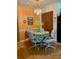 Dining room featuring a table with colorful tablecloth, closet, and black refrigerator at 4558 Blossom Blvd # D, Zephyrhills, FL 33542