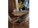 Cozy dining area featuring seating for four and a charming centerpiece at 4558 Blossom Blvd # D, Zephyrhills, FL 33542