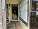 View from the doorway of the home's patio with view to an interior Living Room at 4558 Blossom Blvd # D, Zephyrhills, FL 33542